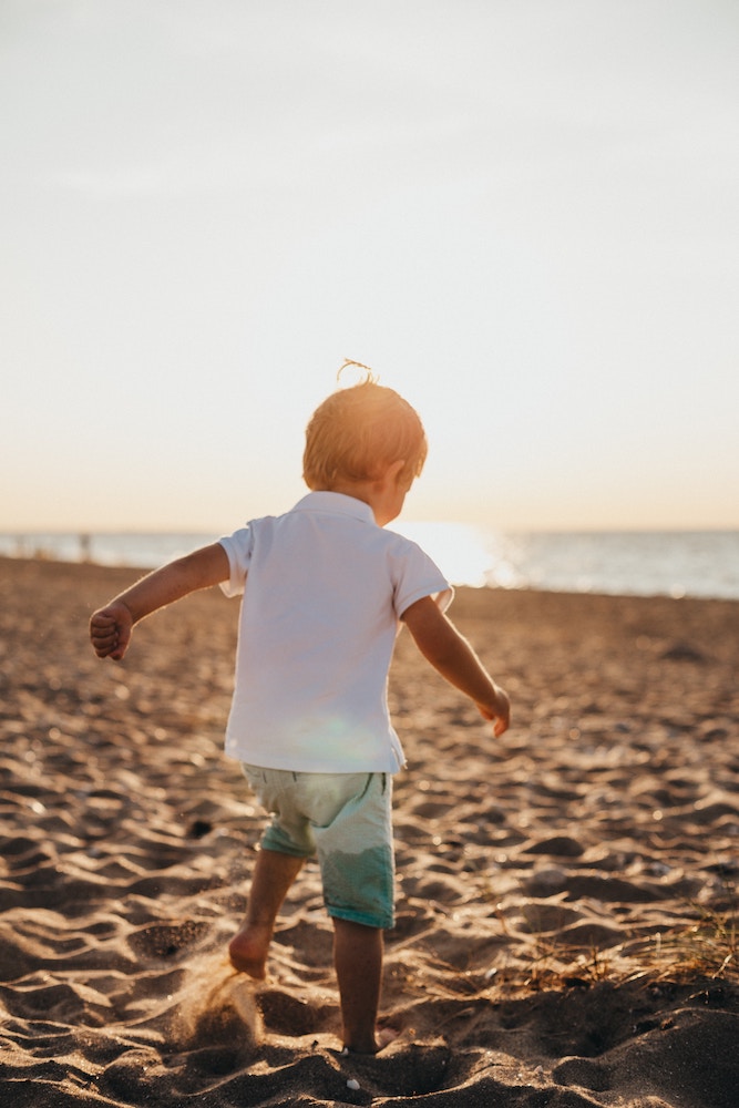 Boy playing on beach